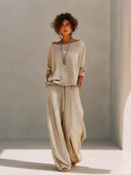Model in a slouchy khaki knit sweater set with wide leg drawstring pants - view 4