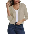 Woman wearing a cropped open front cardigan with 3/4 sleeves over a white tank and jeans - view 10