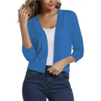 Woman wearing a cropped open front cardigan with 3/4 sleeves over a white tank and jeans - view 14