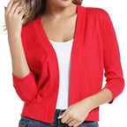 Woman wearing a cropped open front cardigan with 3/4 sleeves over a white tank and jeans - view 18