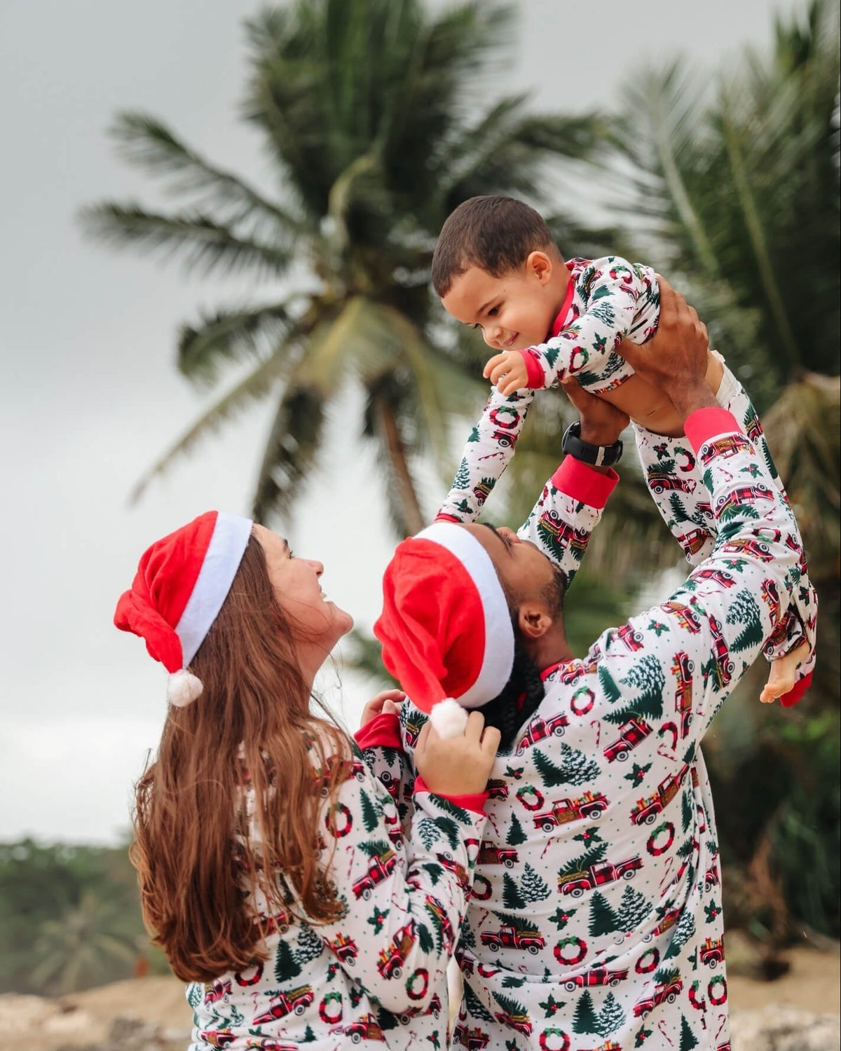 Family matching Christmas pajamas with red plaid tree truck print and red cuffs - view 5