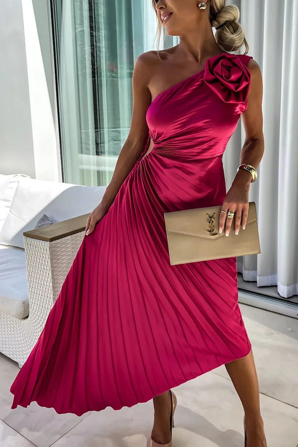 Woman wearing a one-shoulder pleated satin midi dress with a shoulder rosette, waist cutout and asymmetric hem