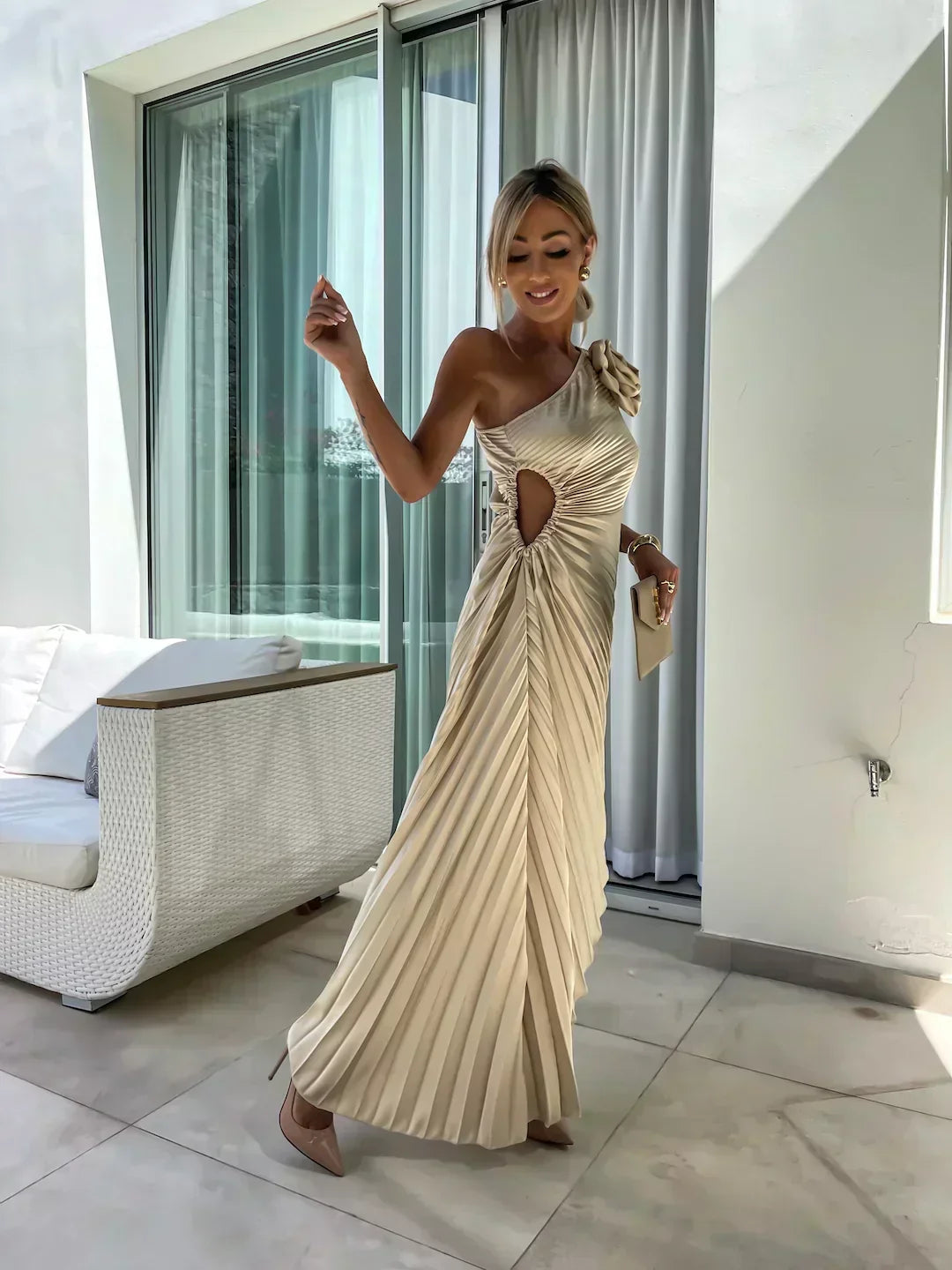 Woman wearing a one-shoulder pleated satin midi dress with a shoulder rosette, waist cutout and asymmetric hem - view 5