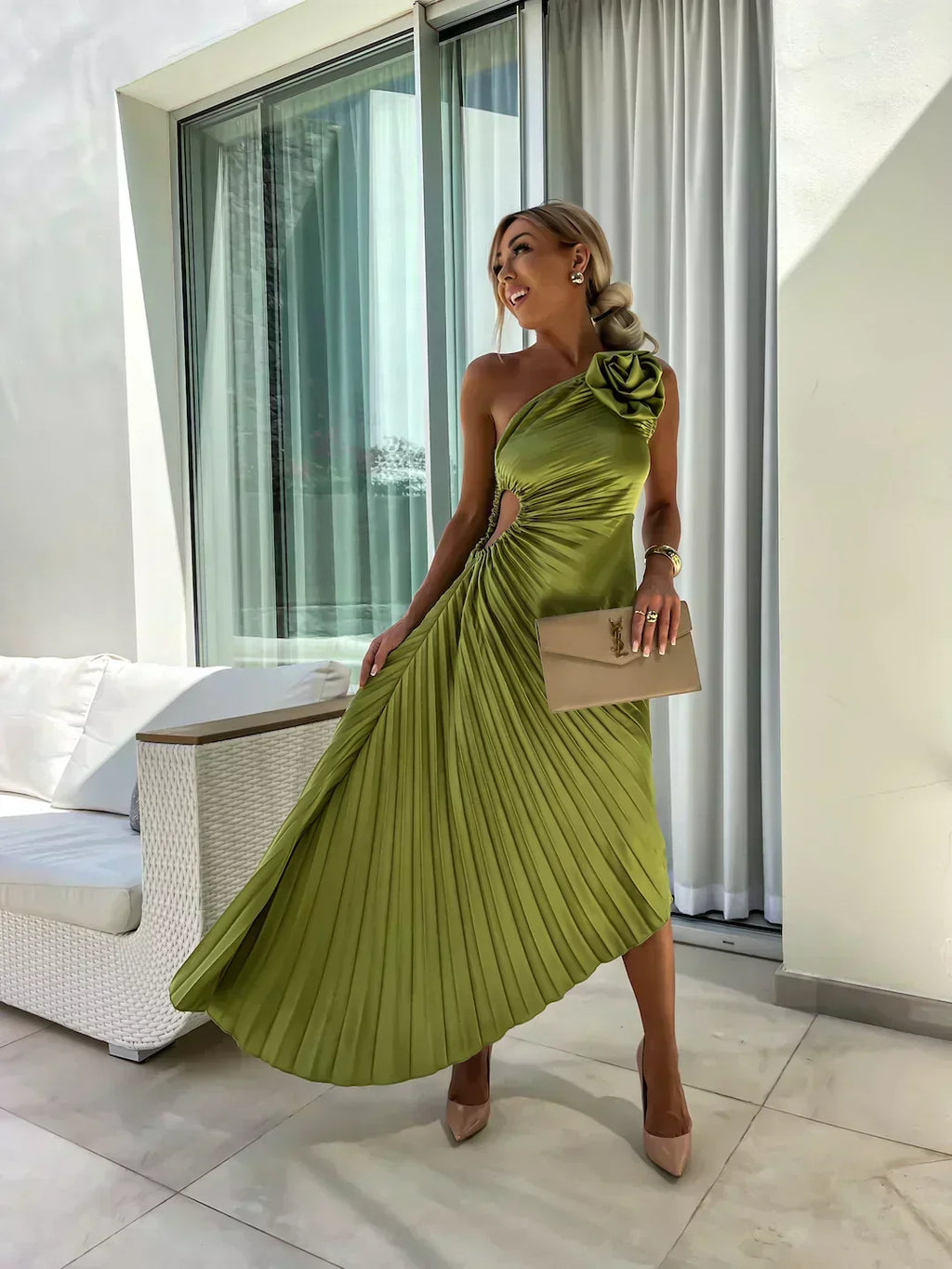 Woman wearing a one-shoulder pleated satin midi dress with a shoulder rosette, waist cutout and asymmetric hem - view 7
