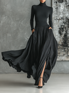Two-piece black turtleneck and crinkle pleated maxi skirt outfit