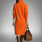 Woman wearing a long sleeve midi sweater dress with a buttoned stand collar and knee-high boots - view 3